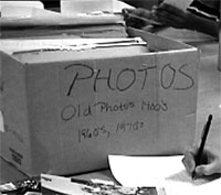 cardboard box
	containing photos in the archive